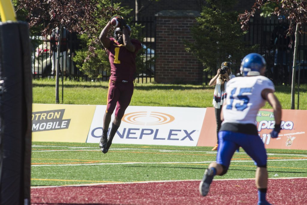 Concordia Running Back Jean-Guy Rimpel making the reception. Photo by Andrej Ivanov.