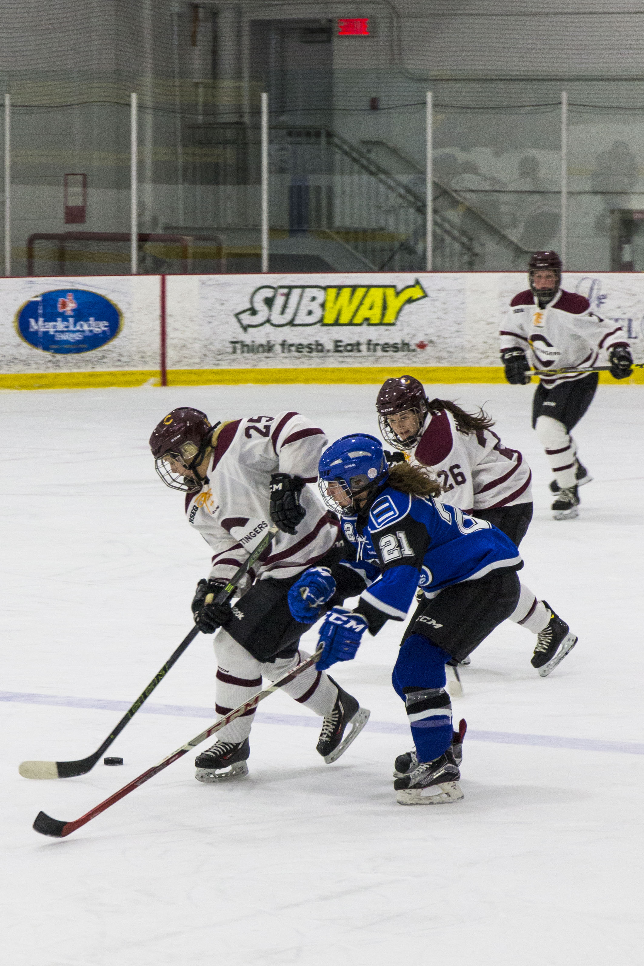 Keriann Schofield fights off a Carabins player during the Stingers loss. Photo by Kelsey Litwin.