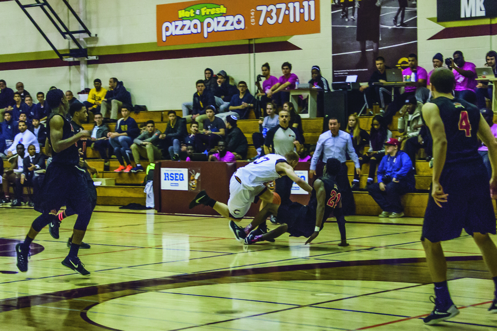 Stingers guard Ken Beaulieu tries to make a move on a Laval defender. Photo by Kelsey Litwin.