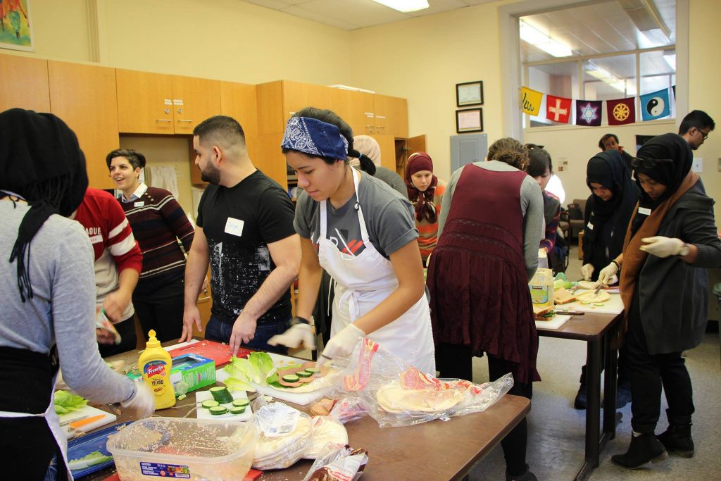 Concordia community members feed the homeless for Multi-Faith Day of Action. Photo by Mishkat Hafiz
