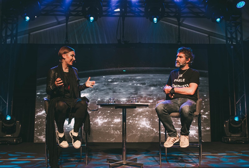 Creative director and co-founder of ALLFUTUREEVERYTHING (AFE), Monika Bielskyte (left), during a panel discussion at C2 Montreal alongside interviewer and executive producer of the National Film Board of Canada, Hugues Sweeney (right). Photo by Kirubel Mehari.