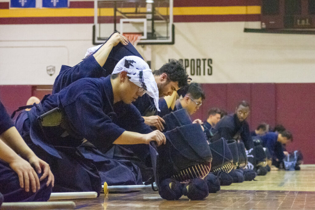 At the end of each training session, students will line up for attendance and to be instructed by the Sensei. (Photo by Lucas Marsh)